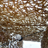 Woven rattan lamppost