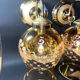 Pair of vintage wall sconces in brass with amber glass globes.