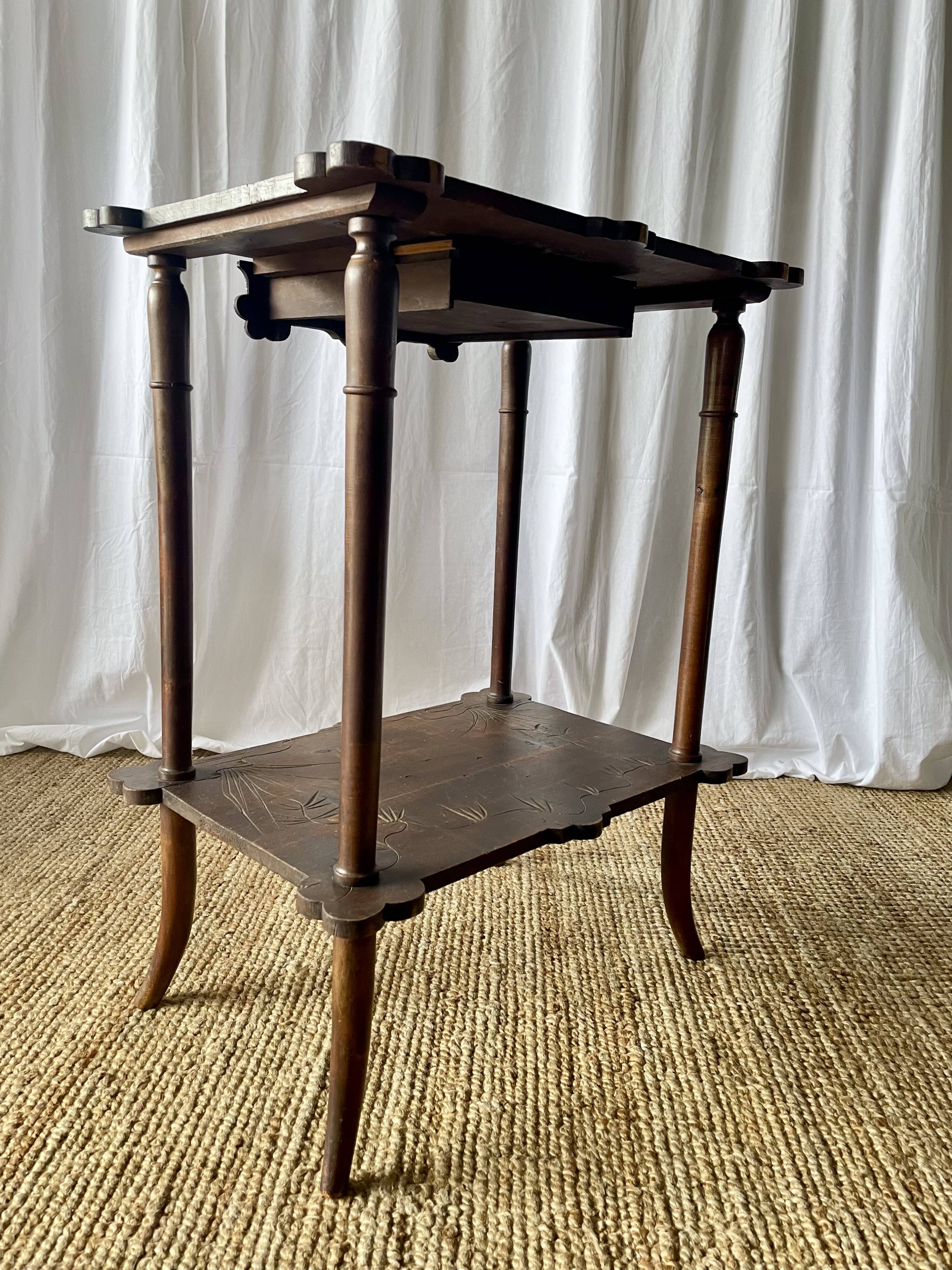 Elegant Art Nouveau side table in walnut, France early 20th century.