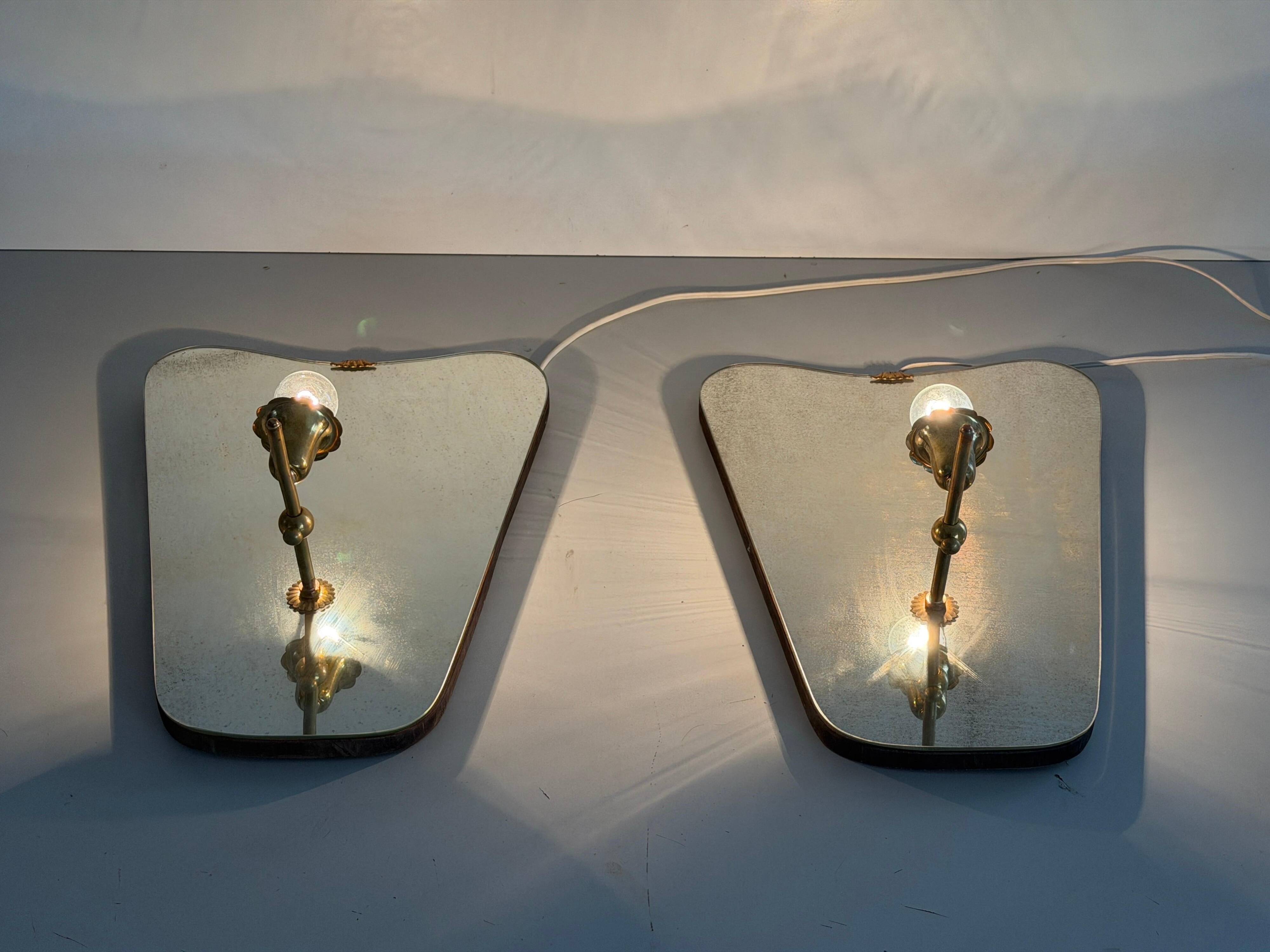 Pair of brass wall lights with mirrors, mid-20th century, Italy, 1960.
