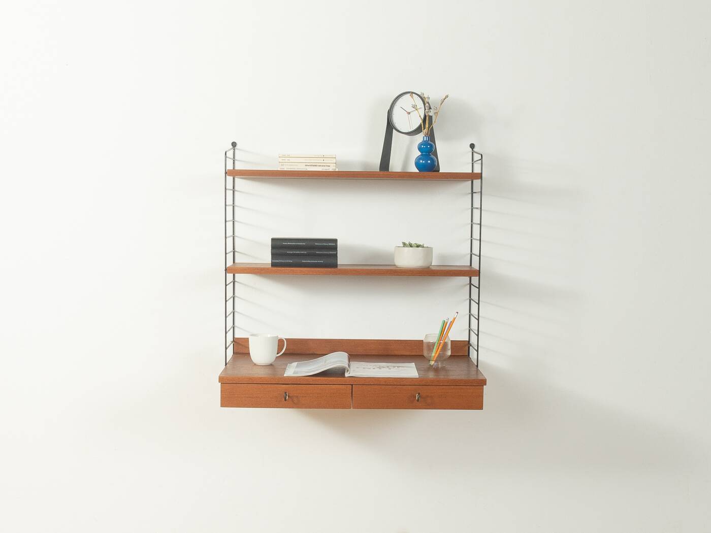 Original String shelf by Nils Strinning in teak veneer, 1949