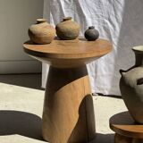 Natural solid mango side table (monoxyle) with conical legs.