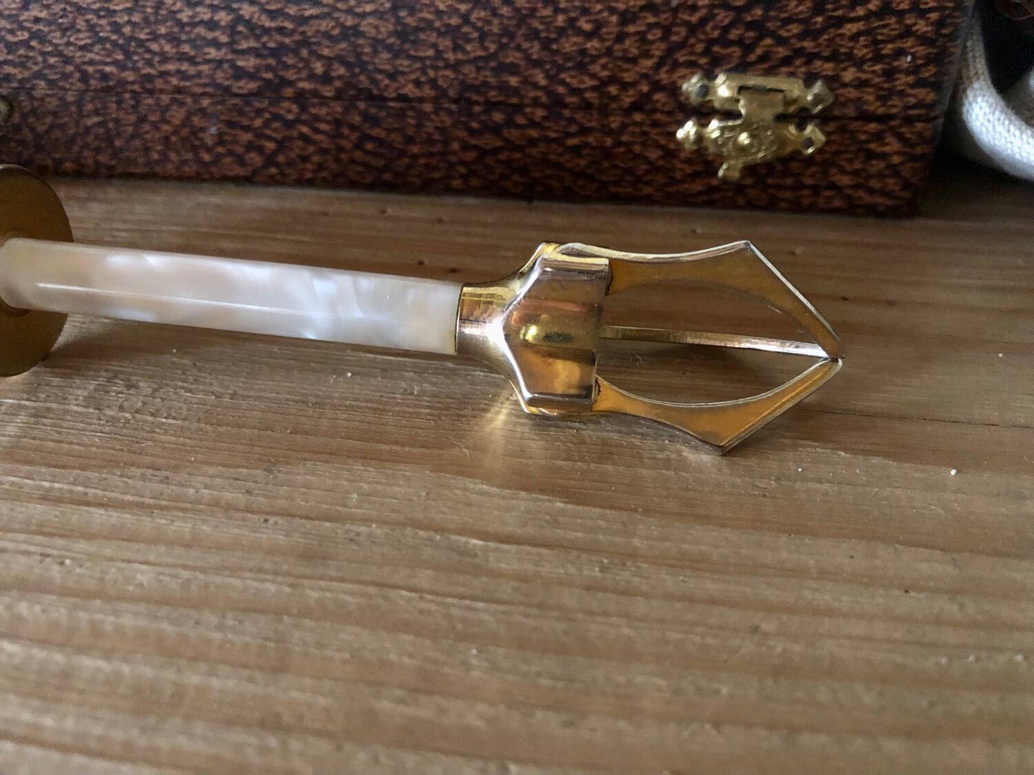 Sugar or ice tongs in their case