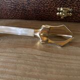 Sugar or ice tongs in their case