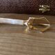 Sugar or ice tongs in their case