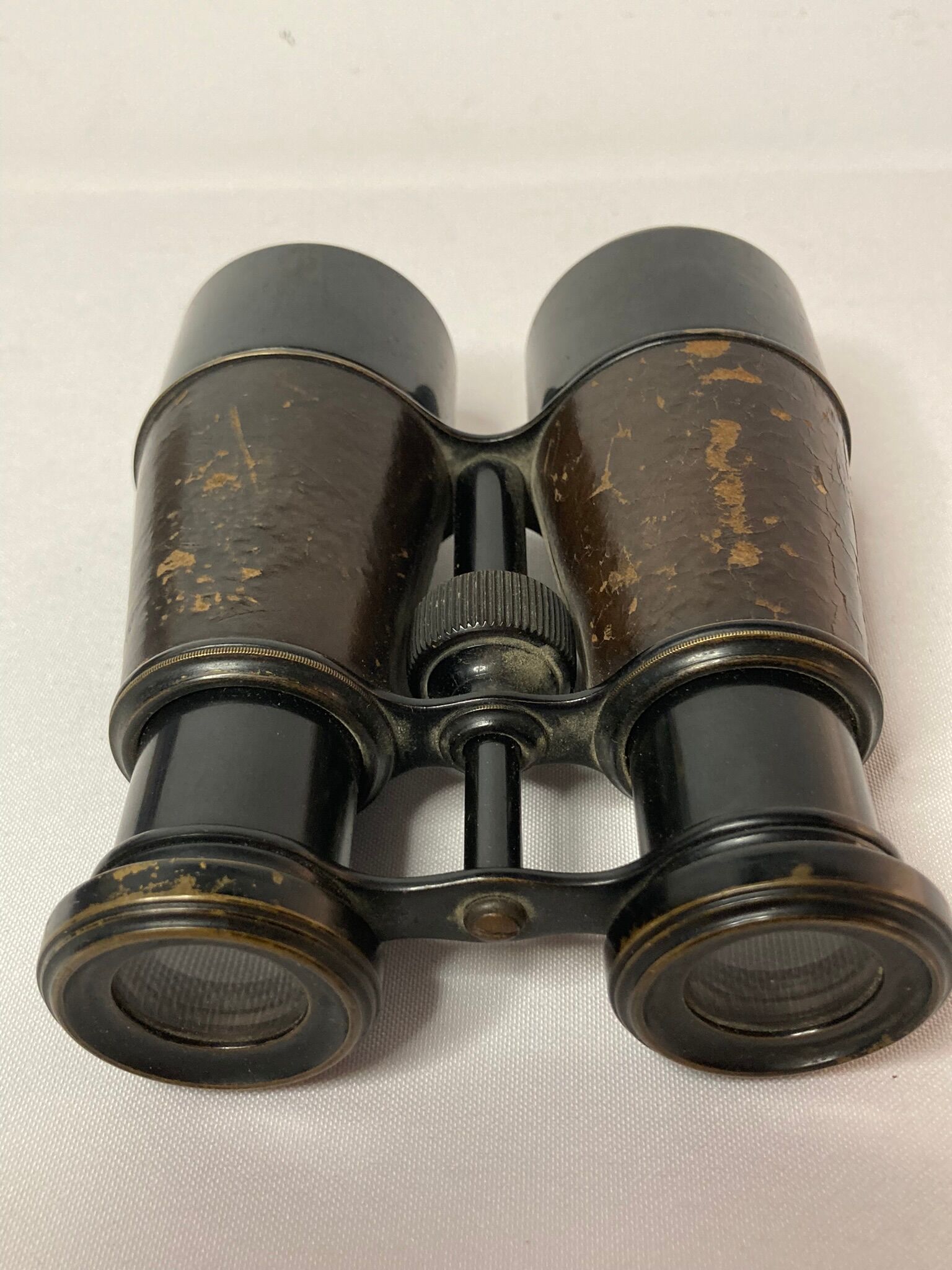 Old pair of XXth leather-wrapped binoculars