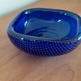 Empty blue bubbled glass pocket