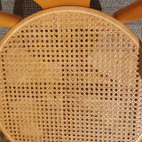 swivel armchair in wood and cane