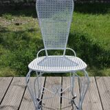 Two small wrought iron chairs