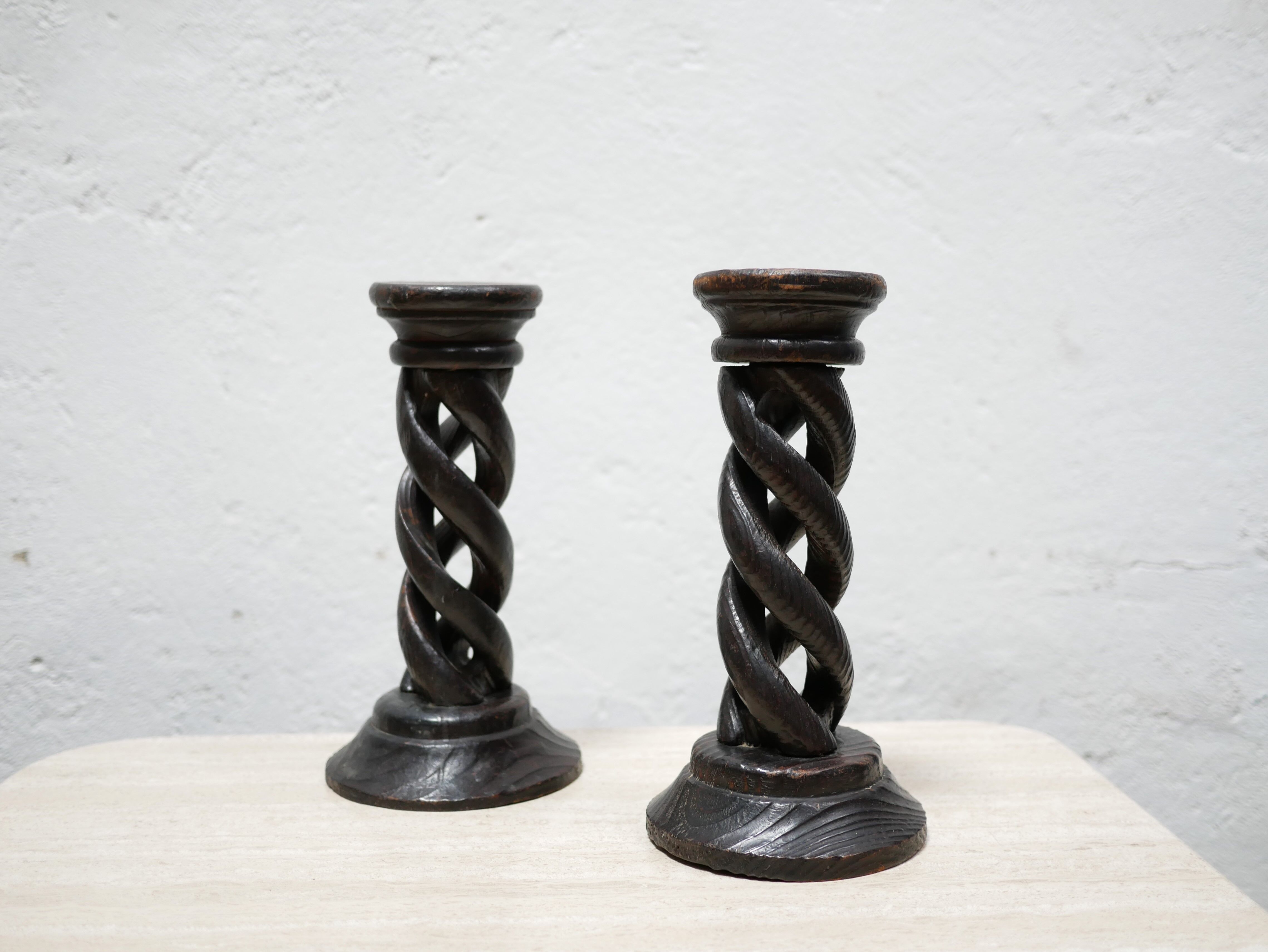 Pair of antique turned wooden candle holders