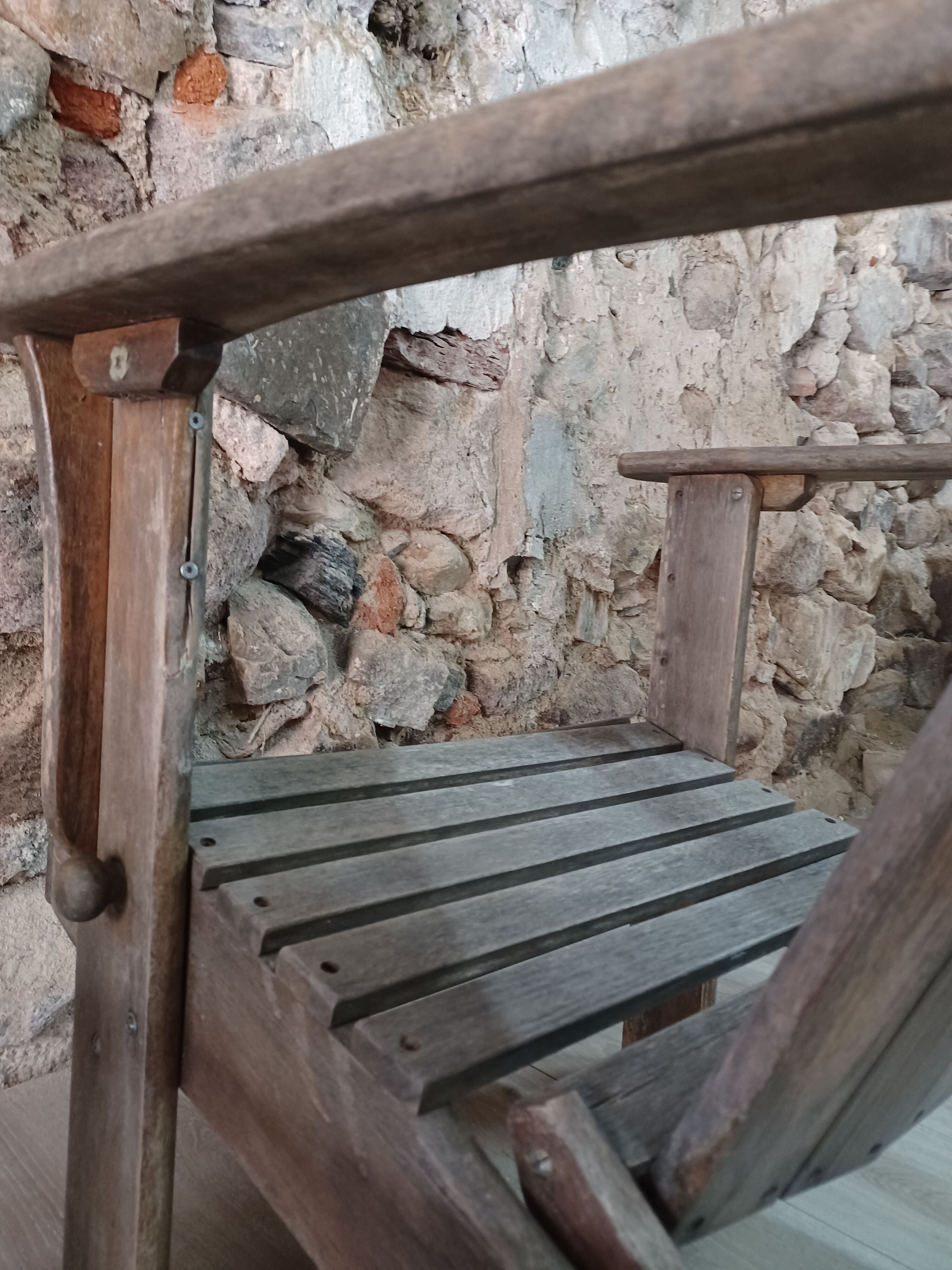 Ancient Adirondack armchair with footrest