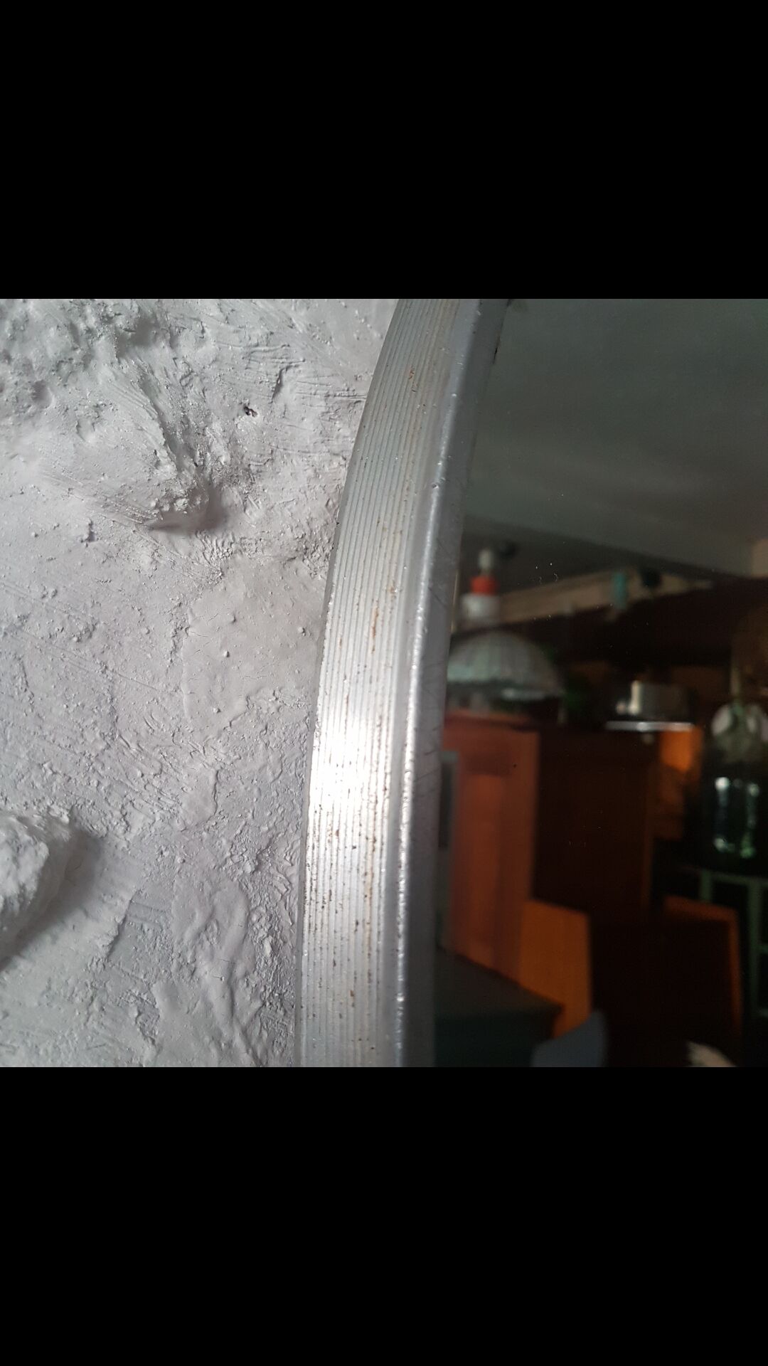 Old aluminum oval mirror