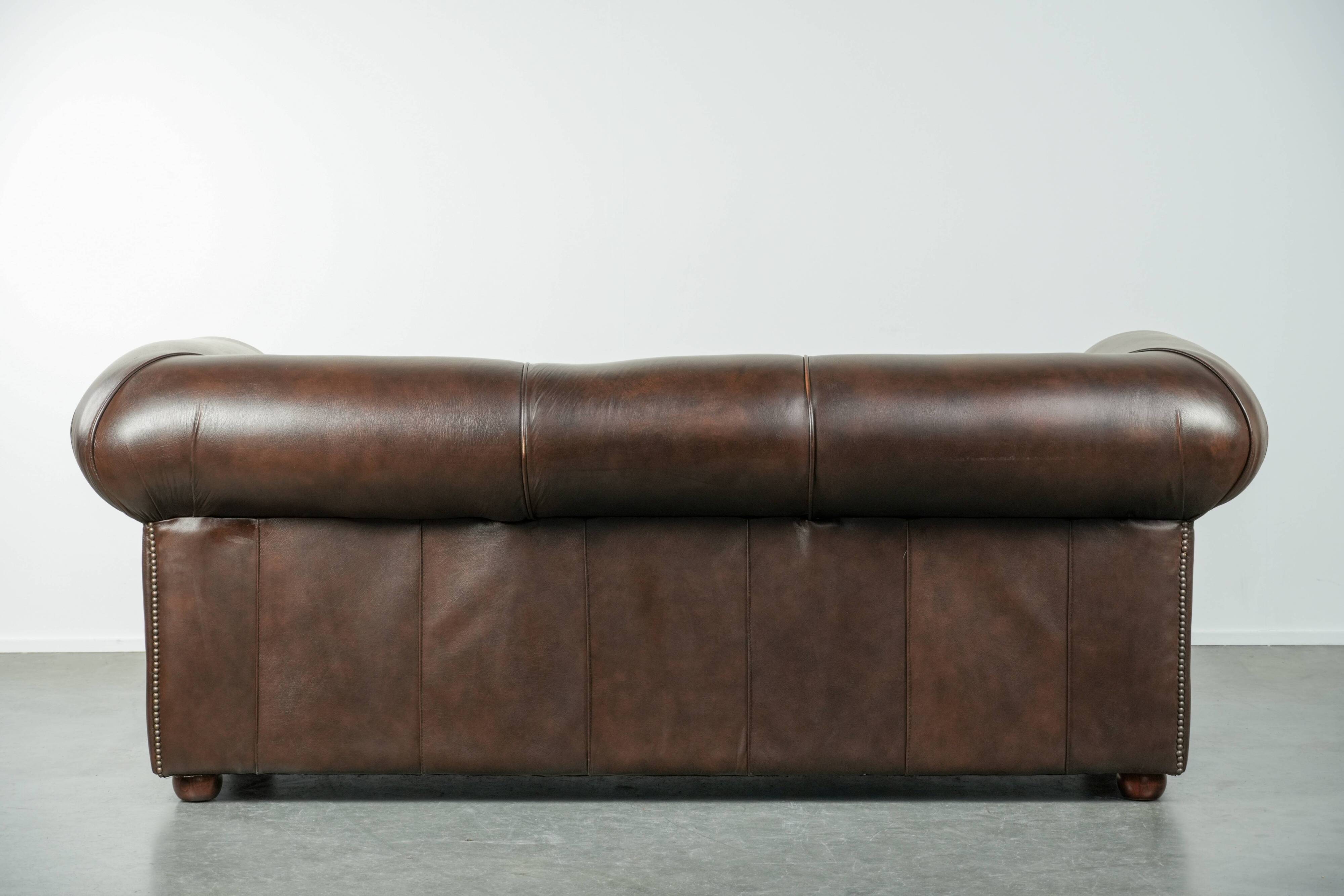 Luxury brown smooth cow leather Chesterfield sofa with an English look