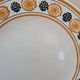 10 dessert plates Saint Amand Amandinoise frilled with orange and black flowers.