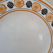 10 dessert plates Saint Amand Amandinoise frilled with orange and black flowers.