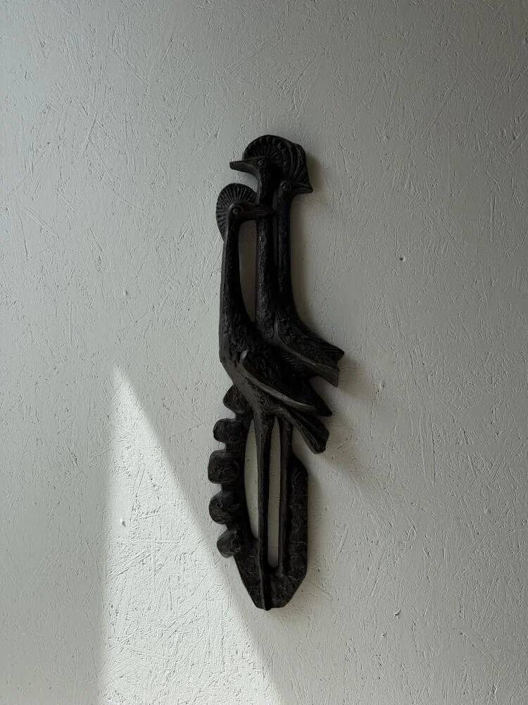 Brutalist wall sculpture with birds Ars Munda