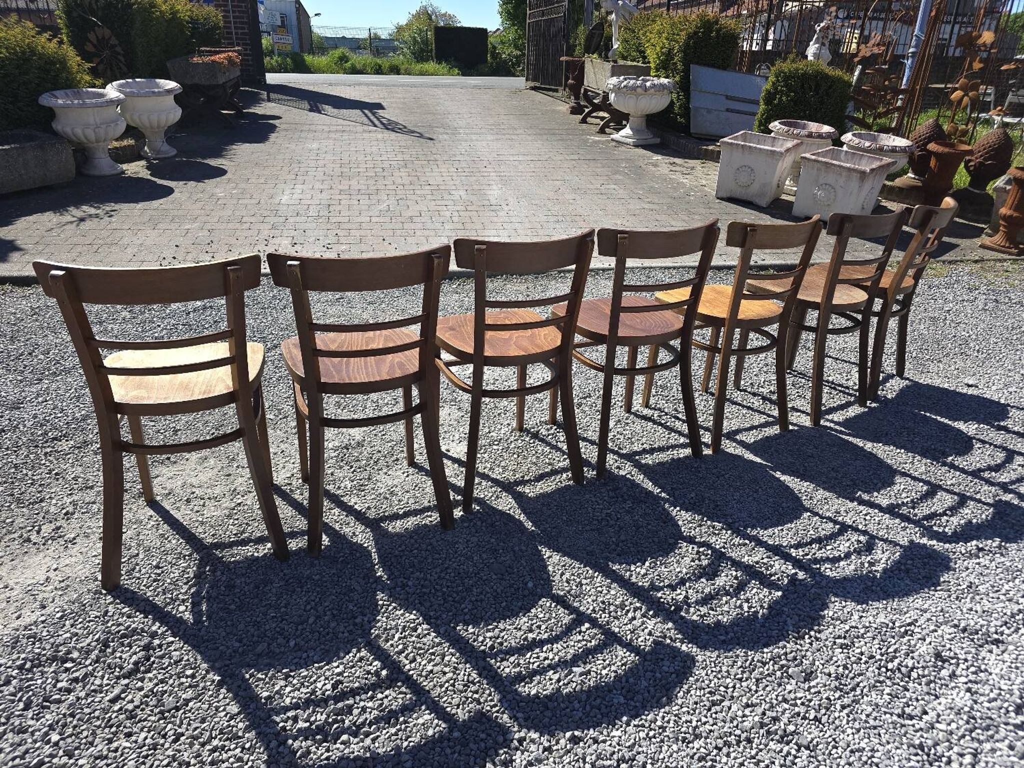 7 curved wooden bistro chairs by Baumann