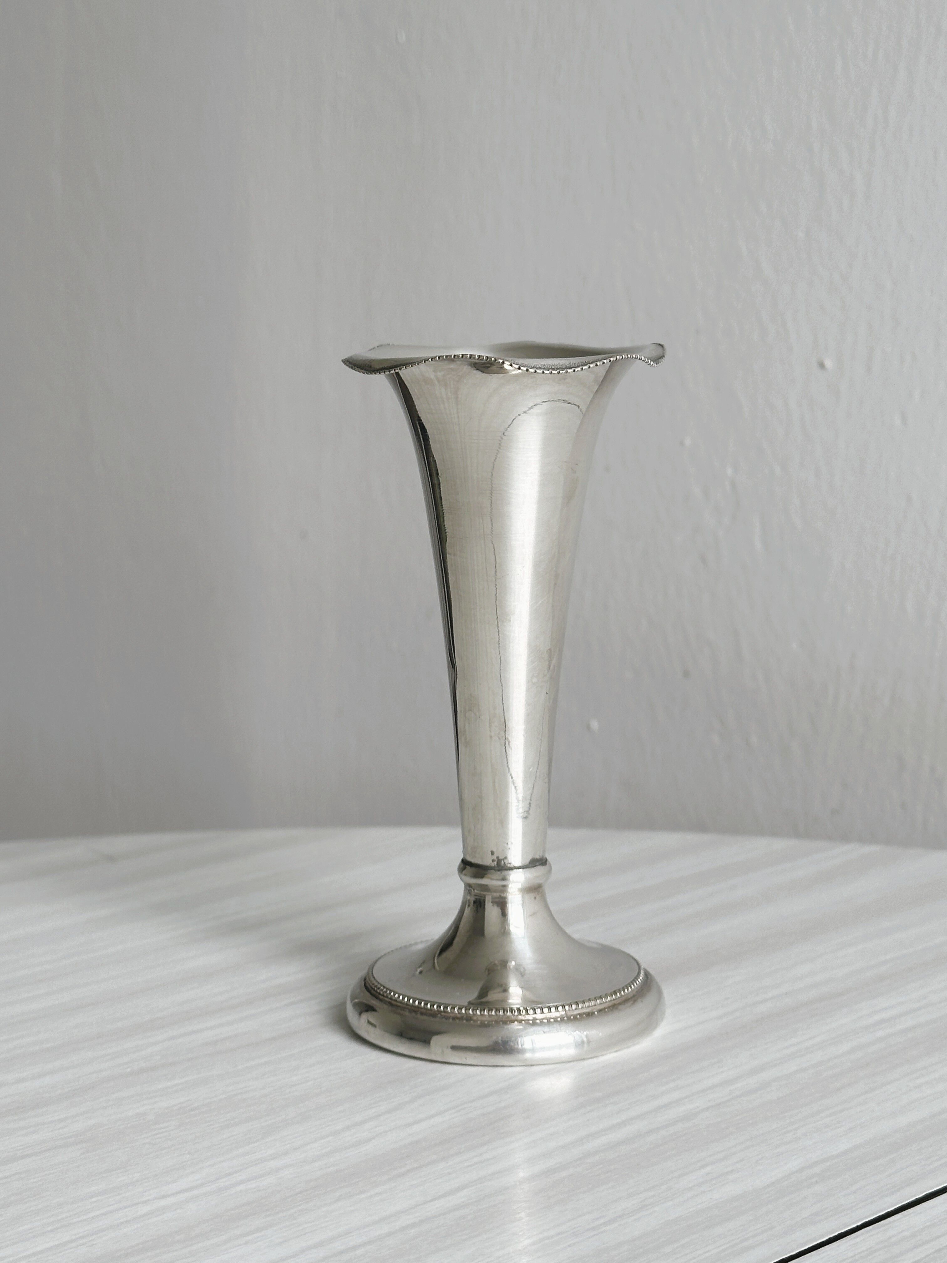 small antique silver-plated metal vase