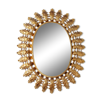 Oval sun mirror in vintage gilded brass 1960