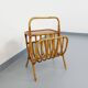 Side table with vintage rattan and wood magazine rack from the 60s