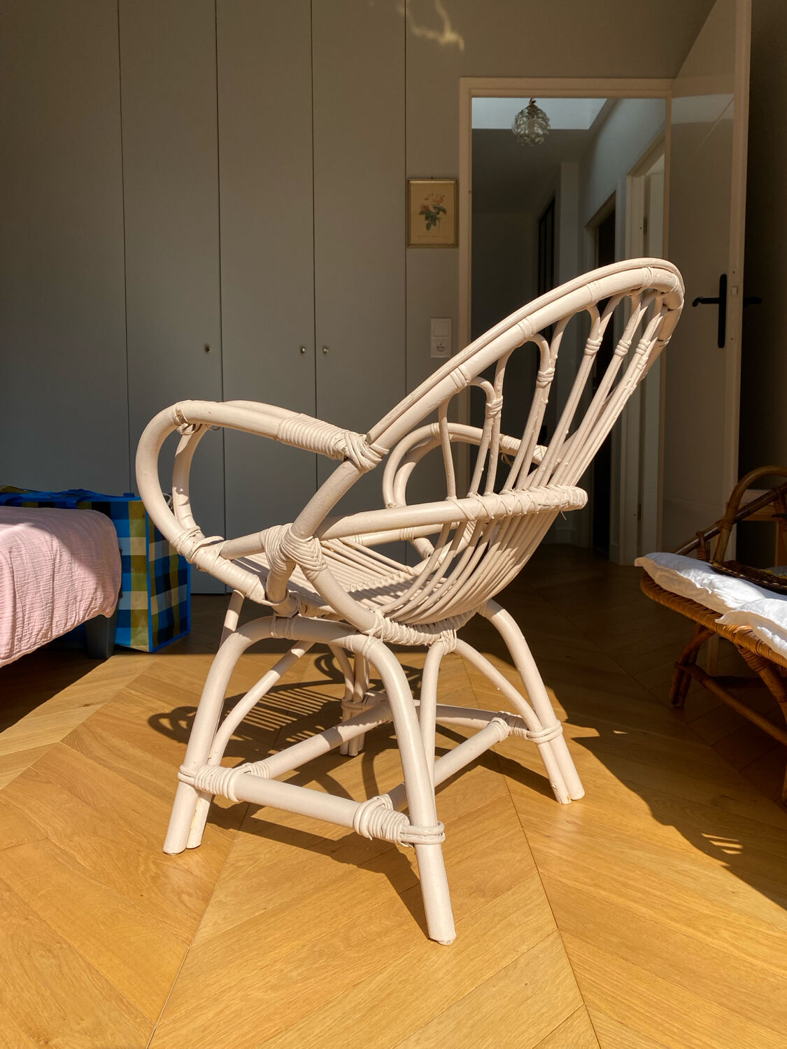 Shell chair in pale pink painted rattan