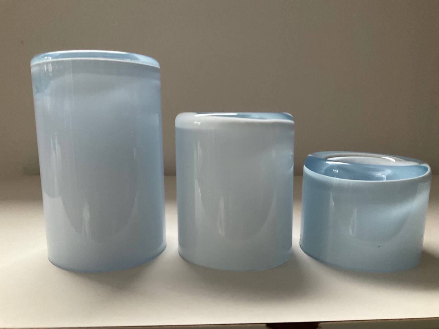 Trio of vintage candlesticks in double-layer glass paste