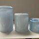 Trio of vintage candlesticks in double-layer glass paste