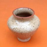 Glazed ceramic spinning top vase with speckled decor