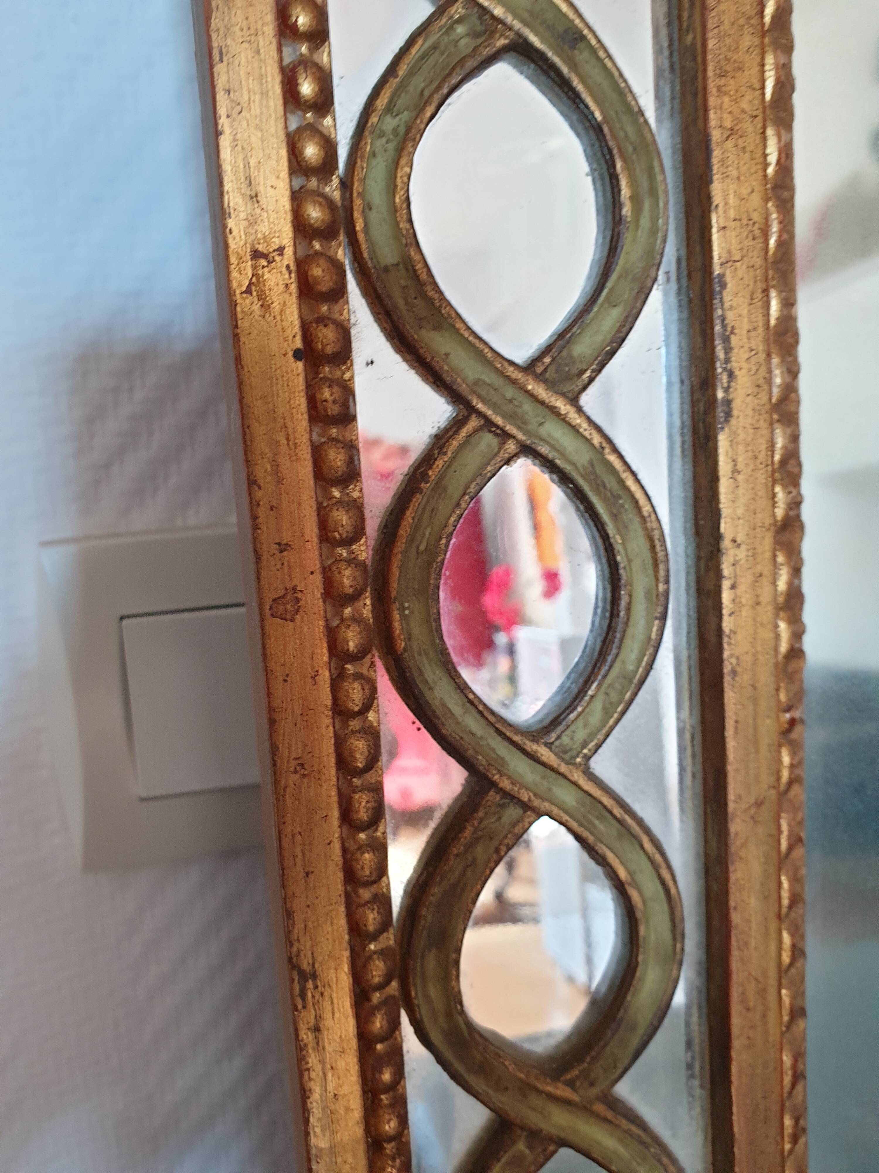 Classic antique mirror in gilded wood