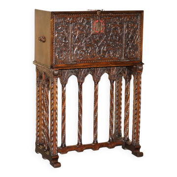 18th-century carved Spanish cabinet with hidden storage.