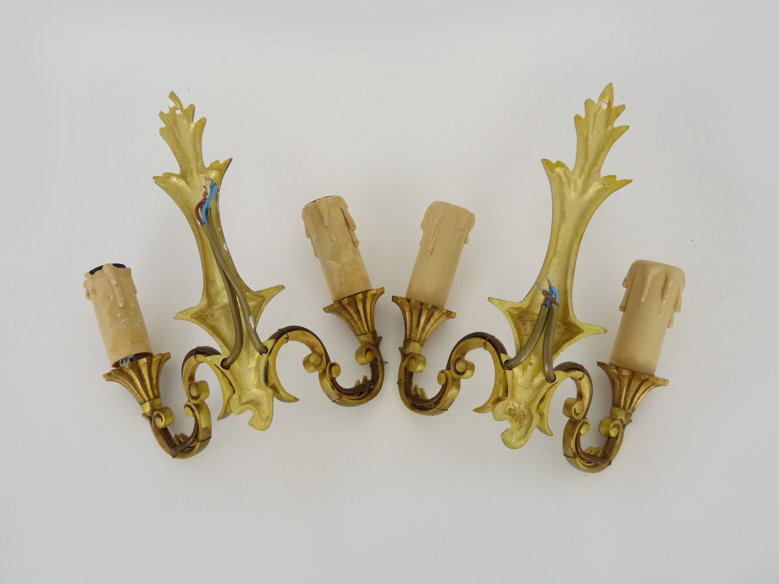 Old pair of wall sconces with double fires in bronze, seventies