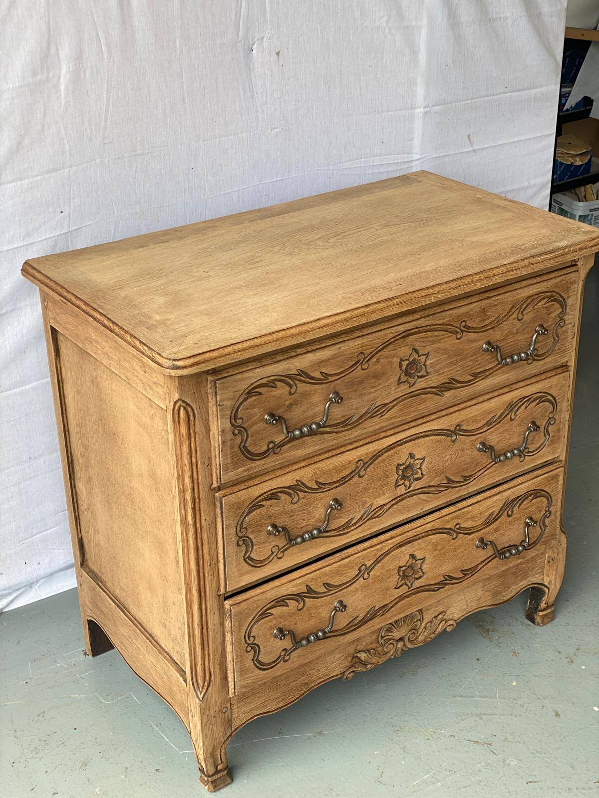 Vintage Louis XV chest of drawers renovated in raw and carved wood
