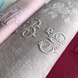 Suite of four antique tinted napkins