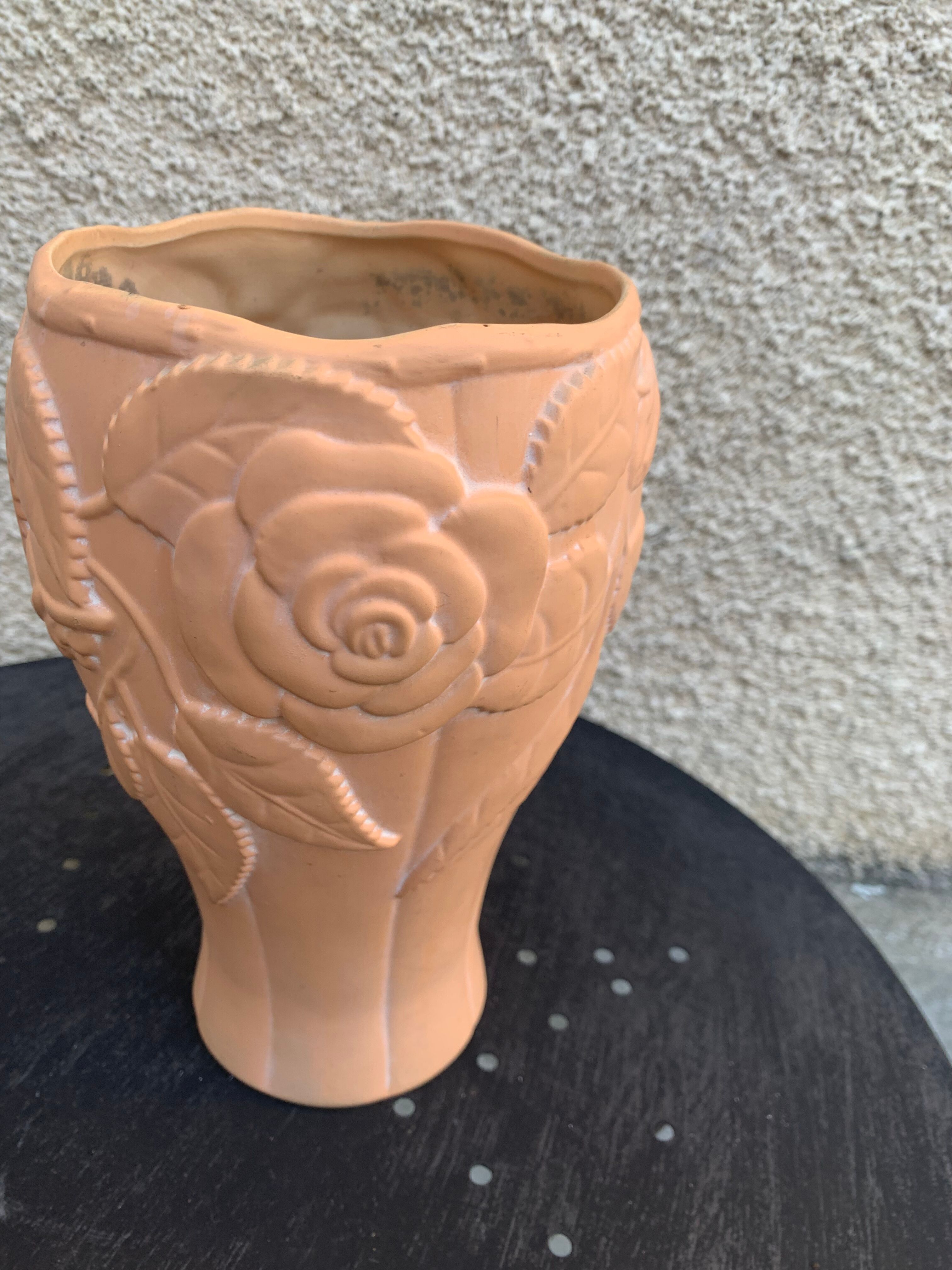 Terracotta vase with a vintage ceramic relief rose pattern