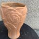 Terracotta vase with a vintage ceramic relief rose pattern