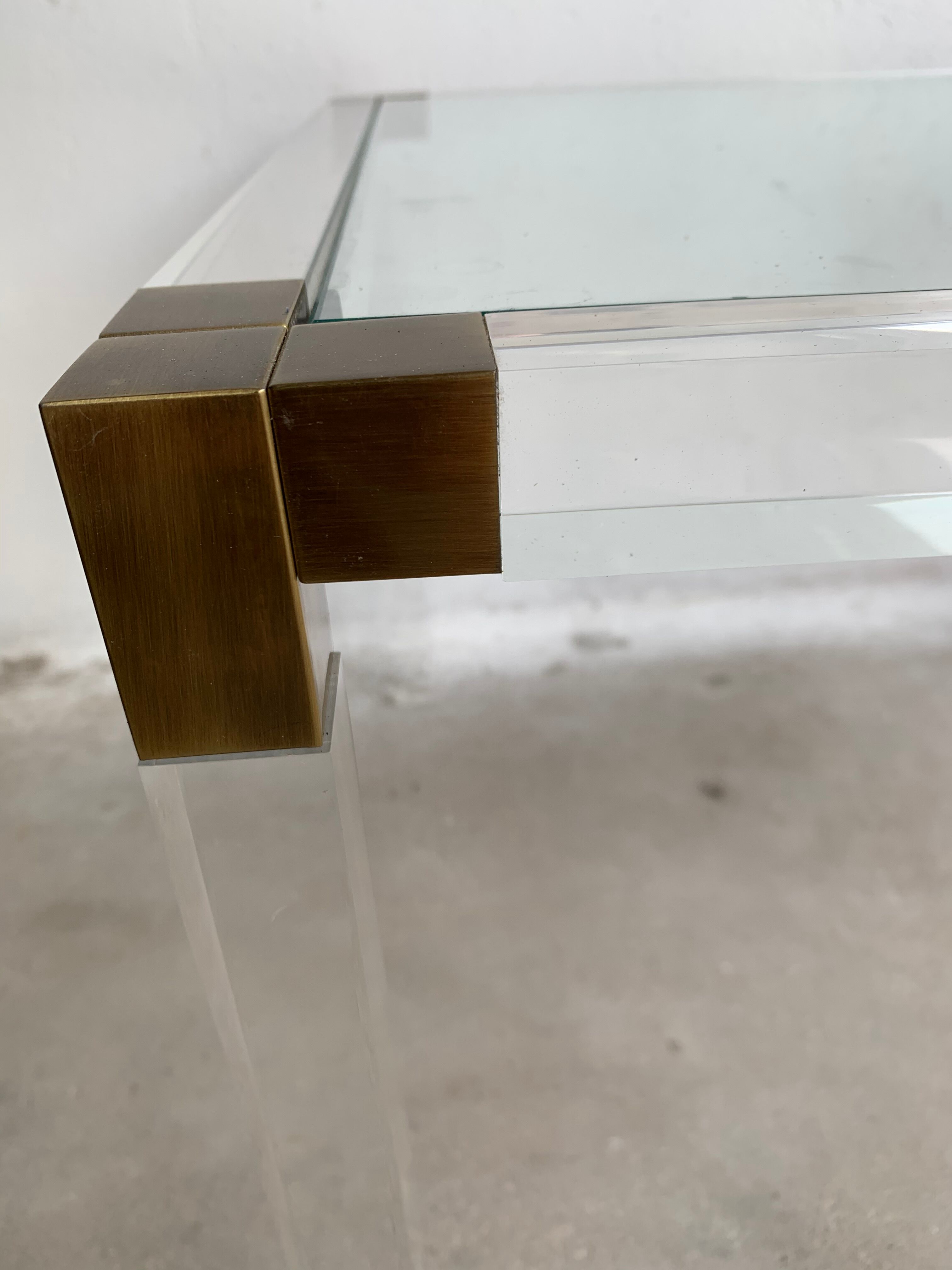 Lucite and brass coffee table by Charles Hollis Jones
