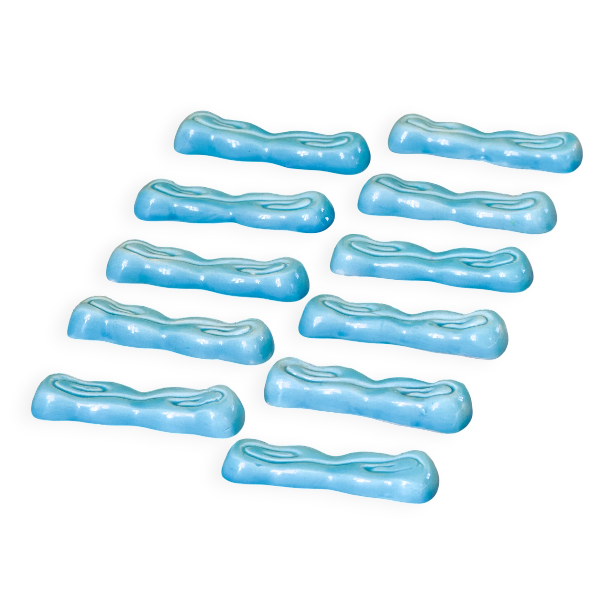 Antique Art Deco knife rest in turquoise earthenware