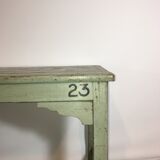 Grey lase wooden bench with inscriptions
