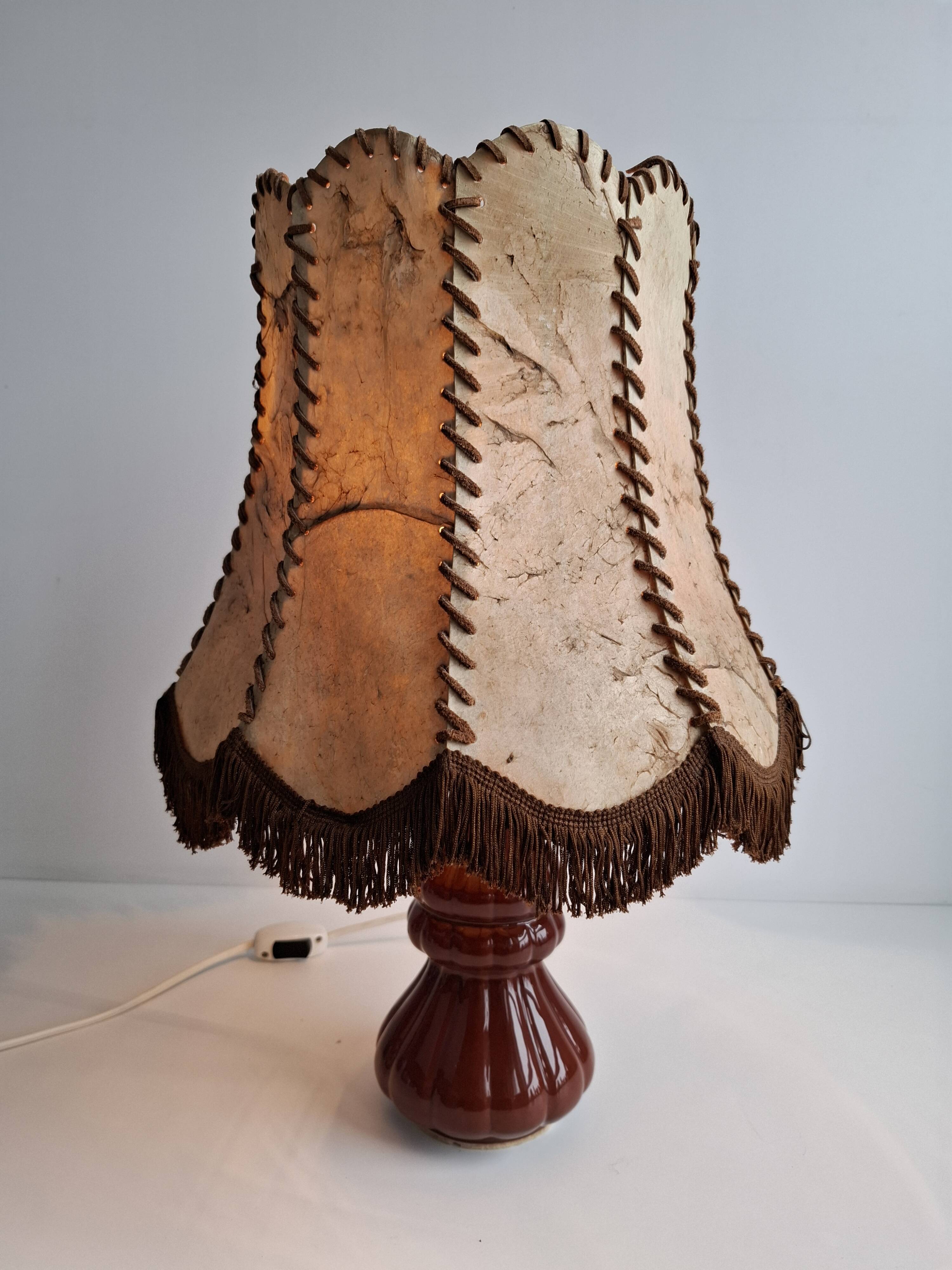 Vintage ceramic table lamp with hand-stitched leather shade, 1980s.