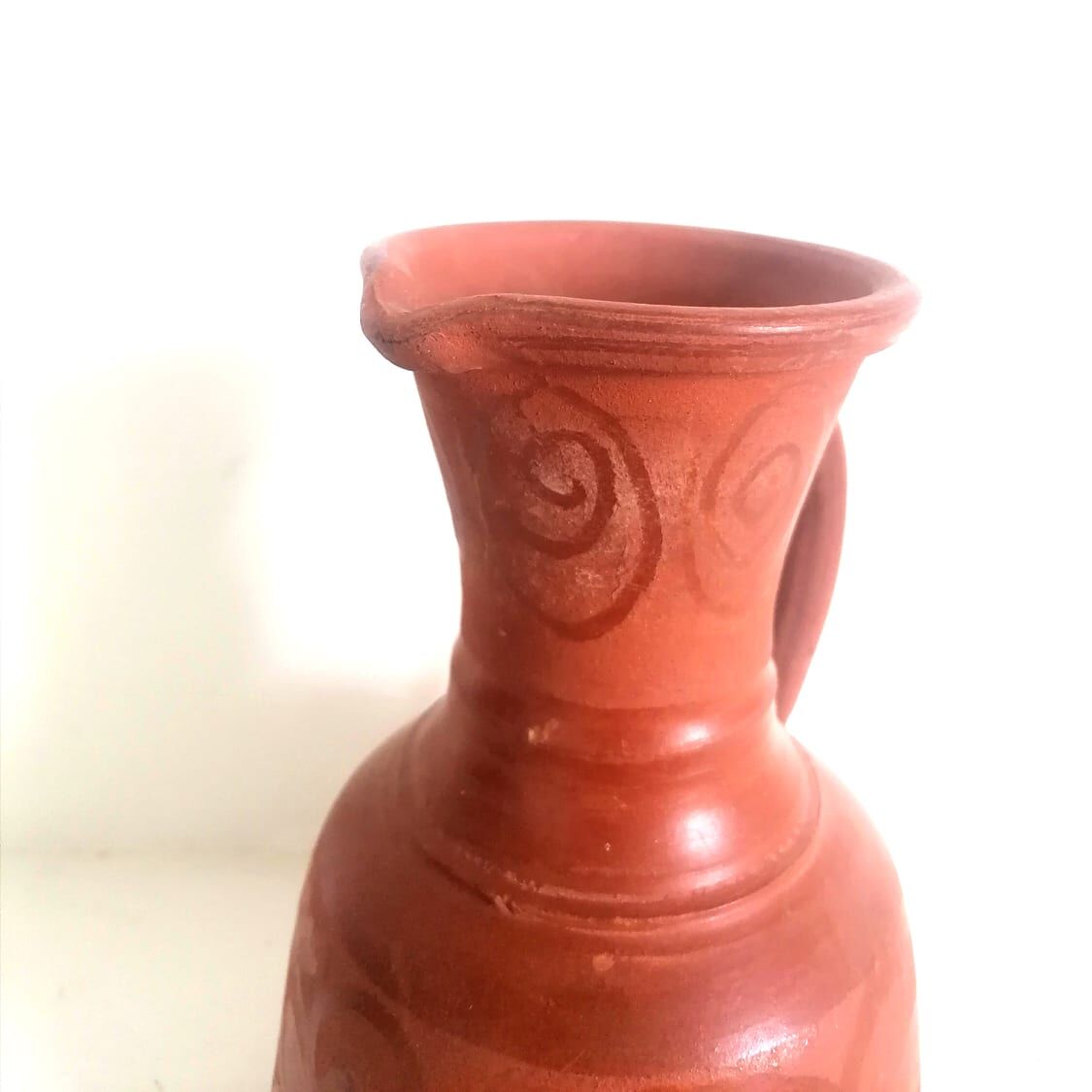Pitcher in oriental terracotta