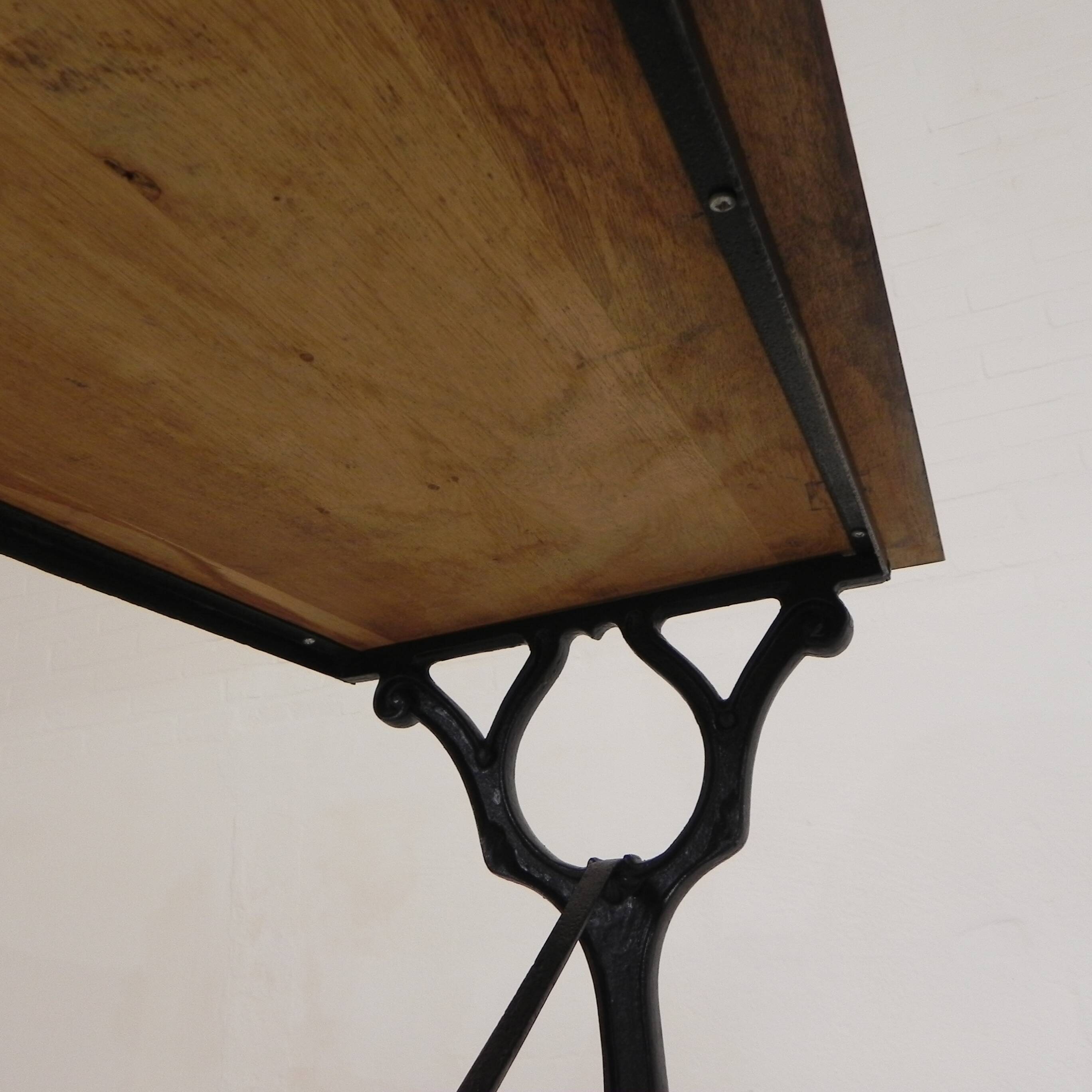 Bistro table with an oak top on a cast iron base, 1930s.