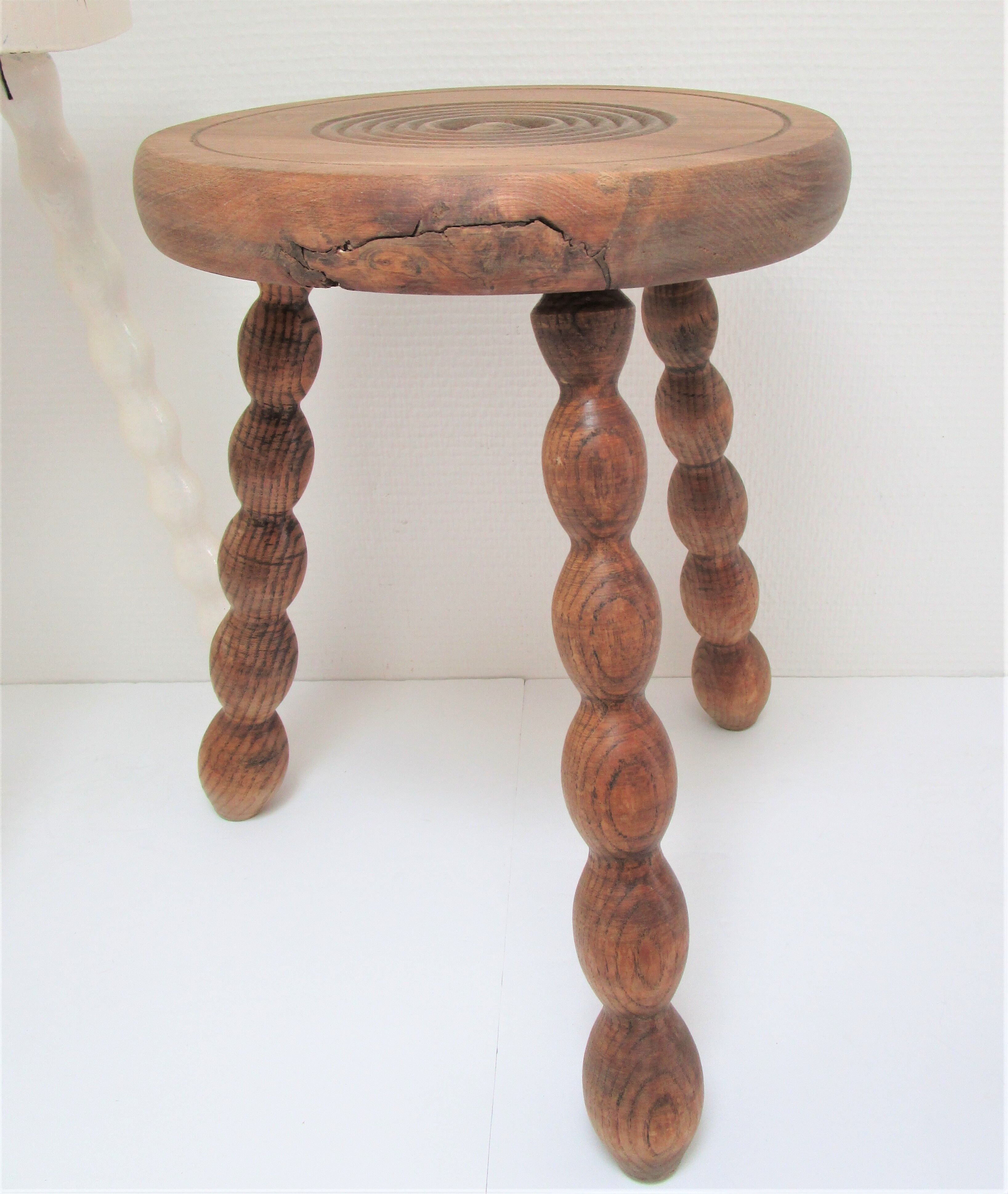 Two vintage tripod solid wood stools