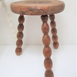 Two vintage tripod solid wood stools