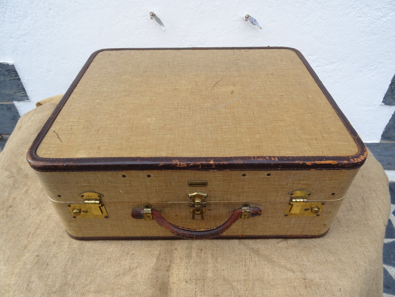 1930s Oshkosh suitcase with bakelite hangers