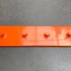 Orange coat rack from the mid-century space age, 1960s.