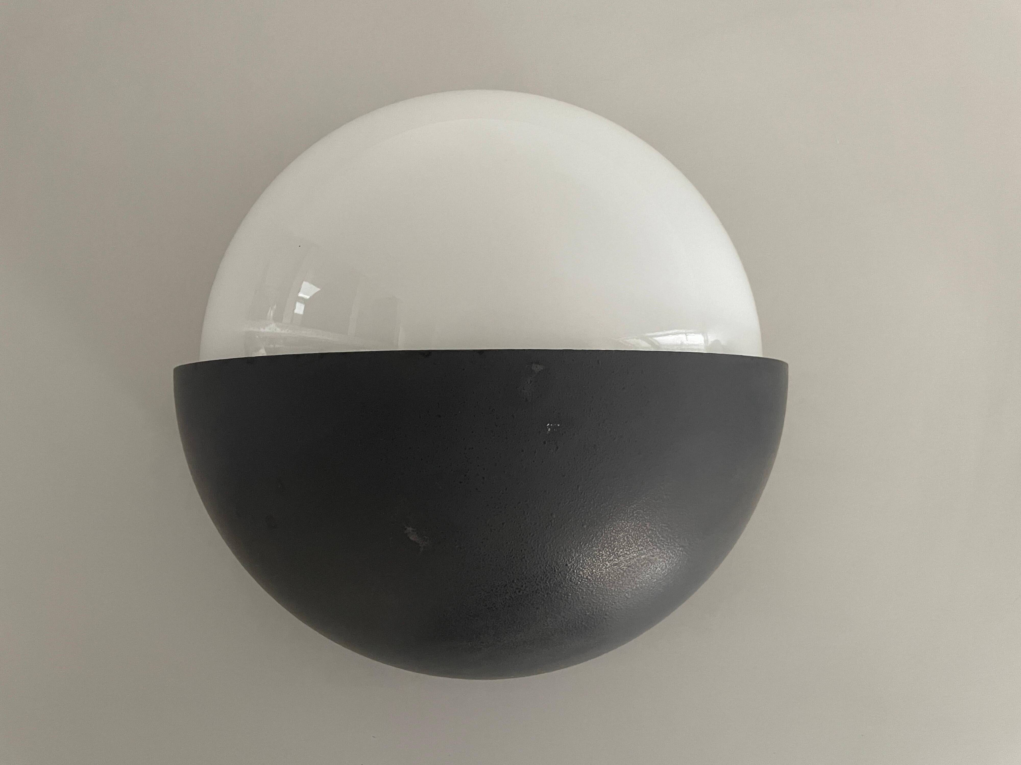 Round black metal wall lights, small and large set, by Bega, 1970s, Germany.