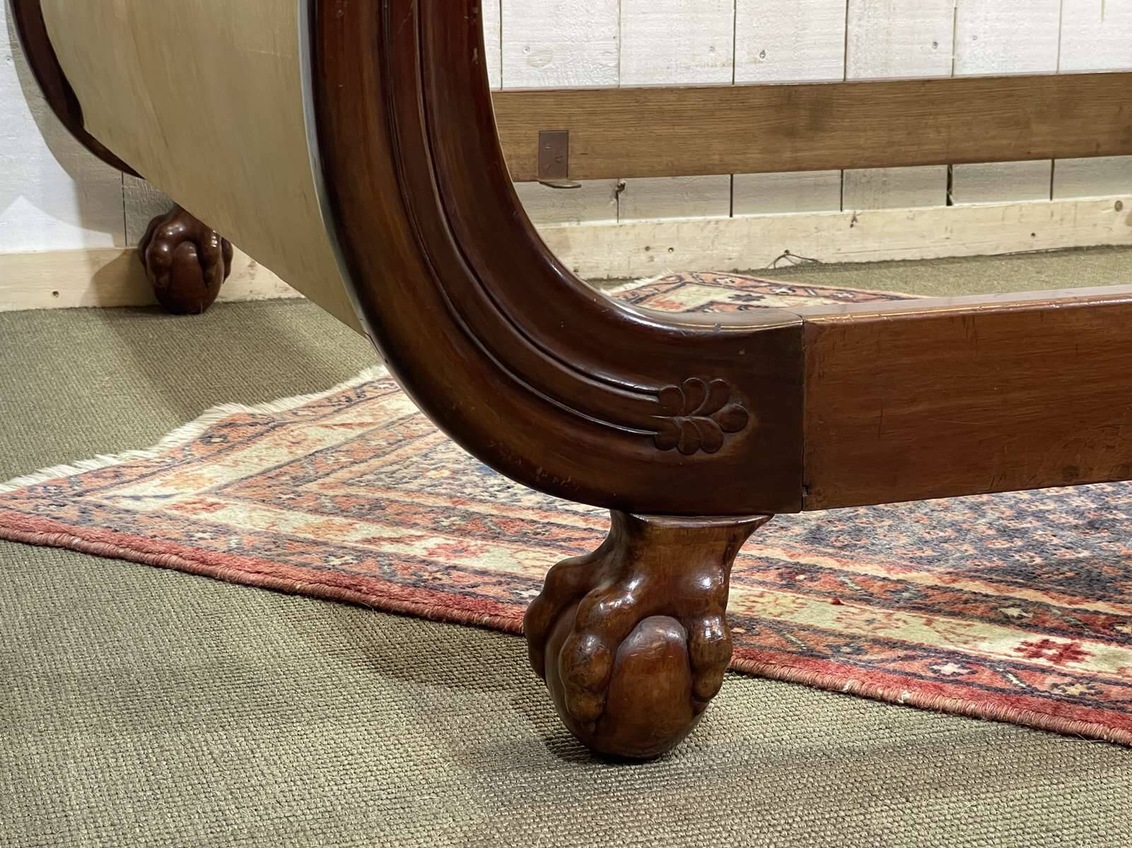 Early 19th century Empire mahogany bed with swan neck finials and claw feet