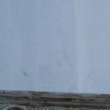 Chic and stylish antique mirror with carved wooden frame in whitewashed