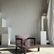 Small low armchair in varnished brown wood