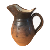 Antique ceramic pitcher with drips and striated patterns gradients of chestnuts